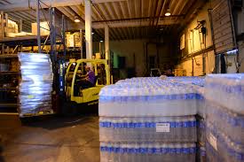 truck commissary, stacks of water-bottles.  